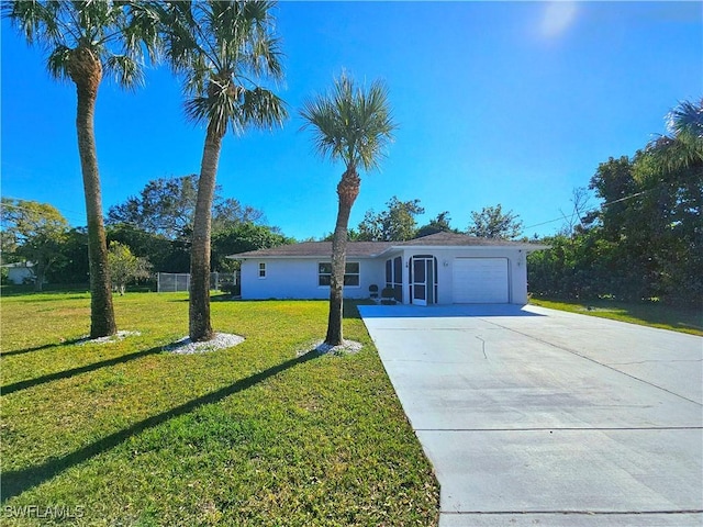 single story home with a garage and a front lawn