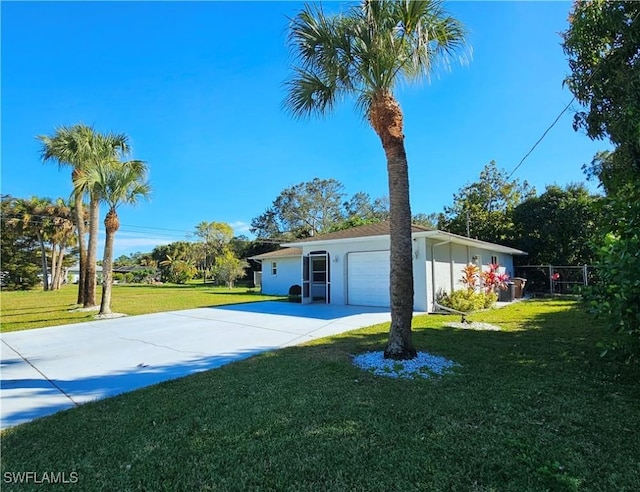 view of property exterior with a garage and a lawn