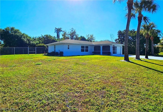 exterior space featuring a garage and a yard