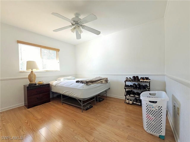 bedroom featuring ceiling fan and light hardwood / wood-style flooring