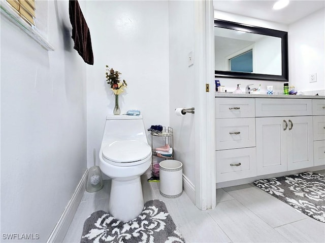 bathroom with vanity and toilet