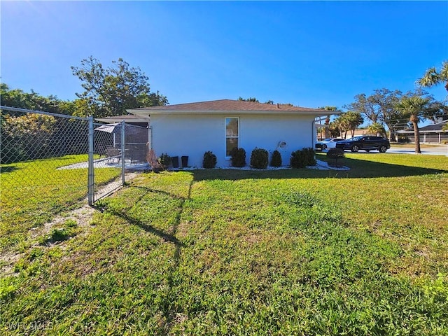 view of property exterior with a yard