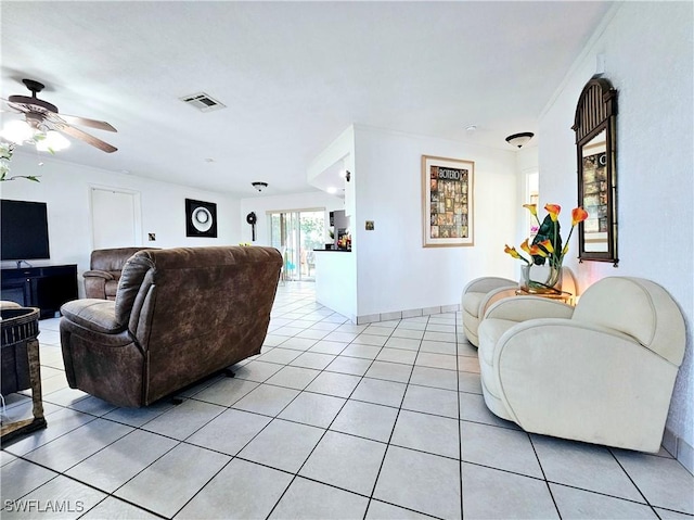 living room featuring light tile patterned floors and ceiling fan