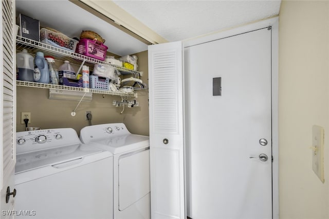 washroom with washing machine and dryer