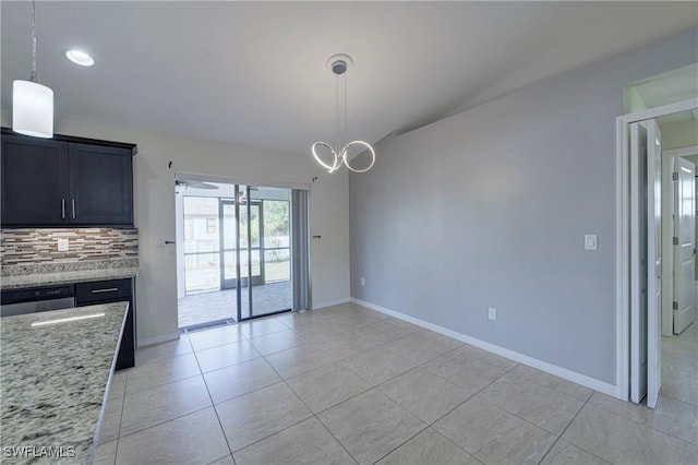 unfurnished dining area with light tile patterned flooring