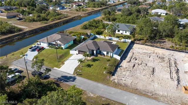 bird's eye view with a water view