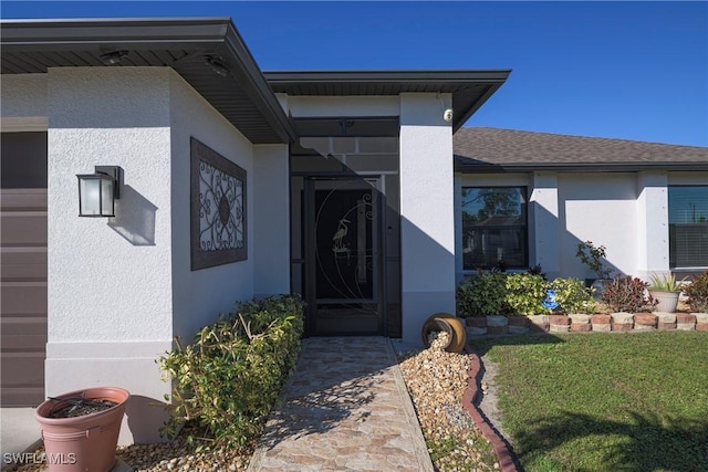 property entrance with a yard