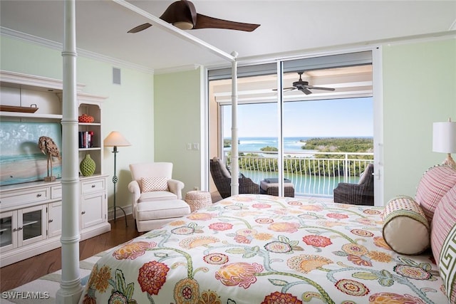 bedroom with dark wood-type flooring, access to exterior, a water view, ornamental molding, and expansive windows