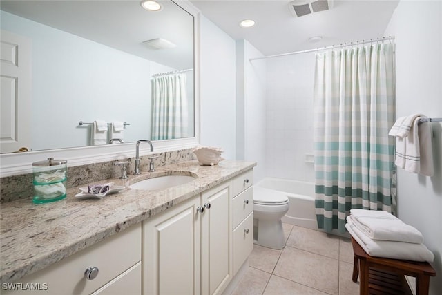 full bathroom featuring tile patterned flooring, vanity, shower / tub combo, and toilet