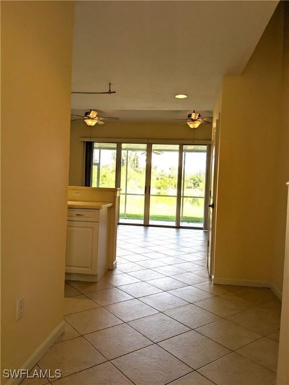 hallway featuring light tile patterned floors