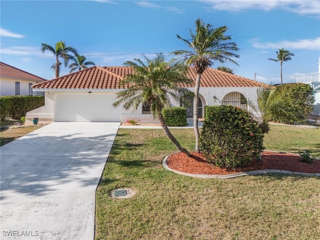 mediterranean / spanish-style home featuring a garage and a front lawn