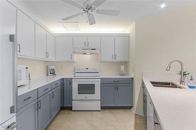 kitchen featuring sink, white appliances, gray cabinets, light tile patterned floors, and ceiling fan