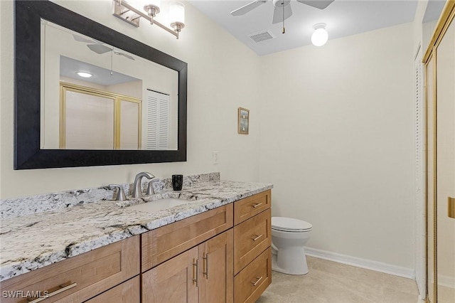 bathroom featuring ceiling fan, tile patterned flooring, vanity, an enclosed shower, and toilet