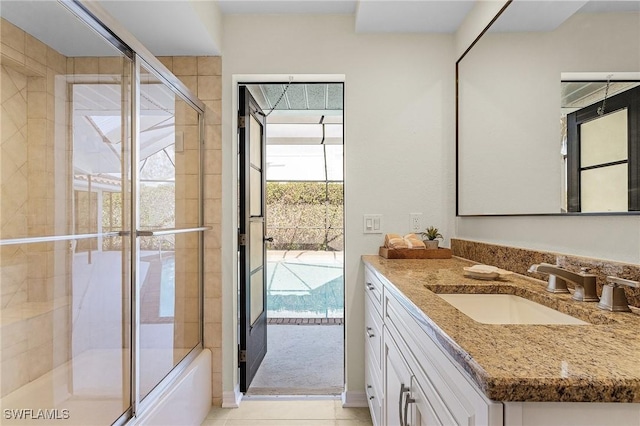 bathroom with tile patterned flooring and vanity