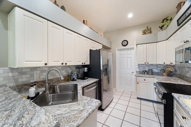 kitchen featuring white cabinetry, appliances with stainless steel finishes, and sink