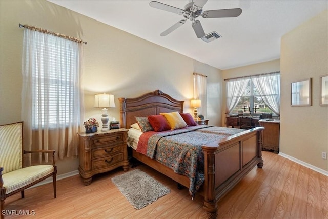 bedroom with ceiling fan and light hardwood / wood-style floors