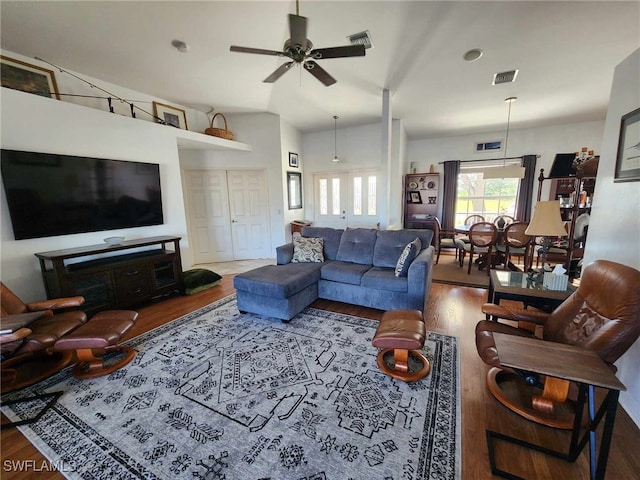 living room featuring ceiling fan and hardwood / wood-style floors