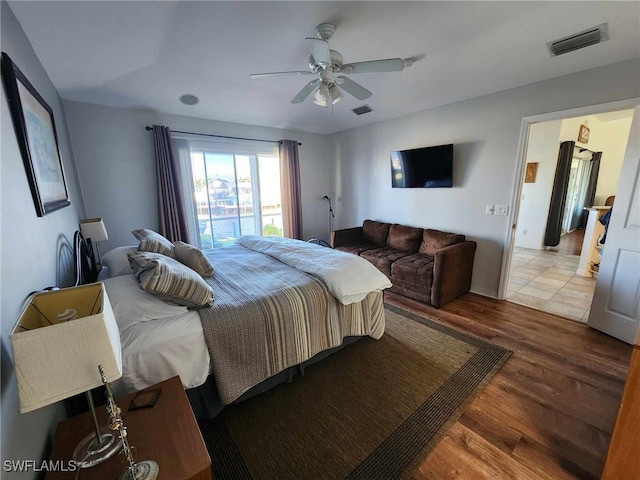 bedroom featuring wood-type flooring and ceiling fan