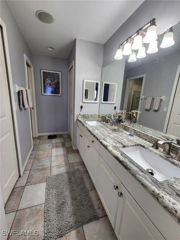 bathroom with vanity and tile patterned floors