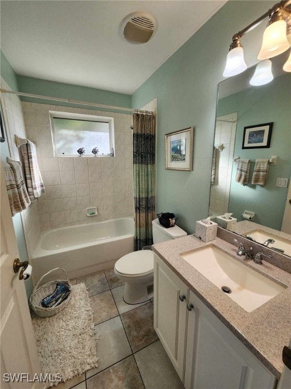 full bathroom featuring vanity, toilet, tile patterned flooring, and shower / bath combo