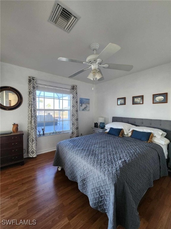 bedroom featuring ceiling fan and dark hardwood / wood-style floors