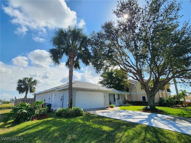 single story home featuring a garage and a front yard