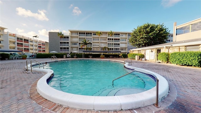 view of swimming pool with a patio