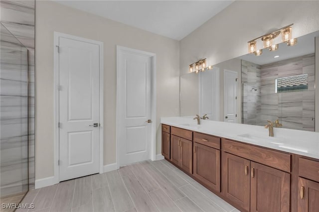 bathroom featuring vanity and a shower with shower door