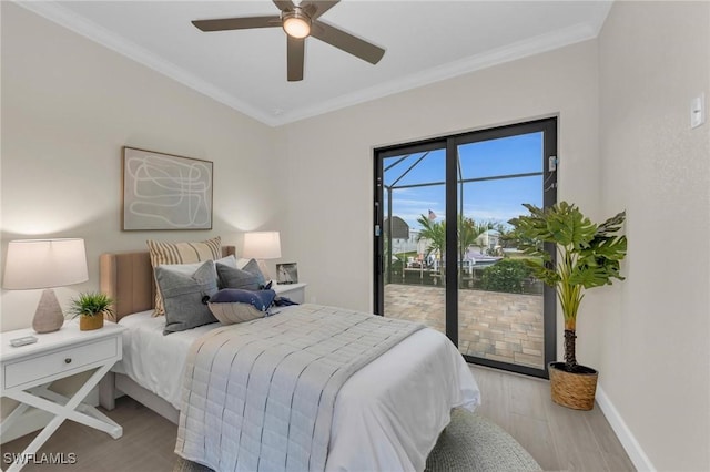 bedroom featuring access to outside, ornamental molding, ceiling fan, and light wood-type flooring