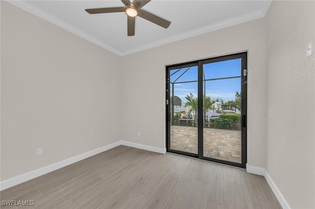 empty room with crown molding, ceiling fan, and light wood-type flooring