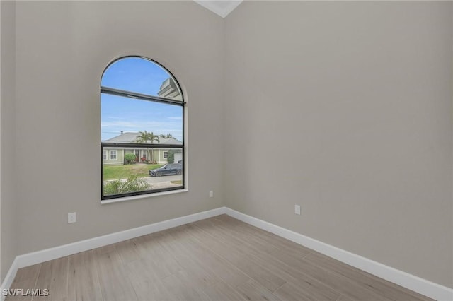 spare room with light hardwood / wood-style flooring