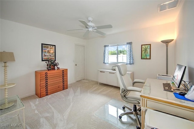 office area with light colored carpet and ceiling fan