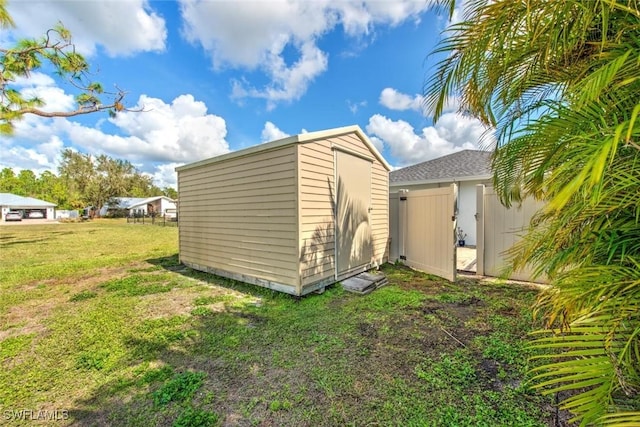 view of outbuilding with a yard