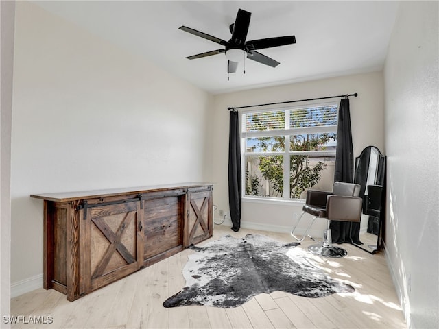 interior space with ceiling fan and light hardwood / wood-style floors