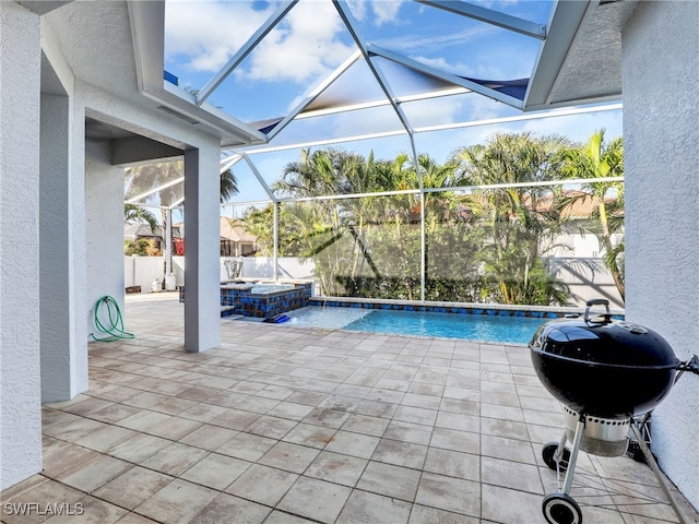 view of swimming pool featuring an in ground hot tub, grilling area, a patio, and glass enclosure