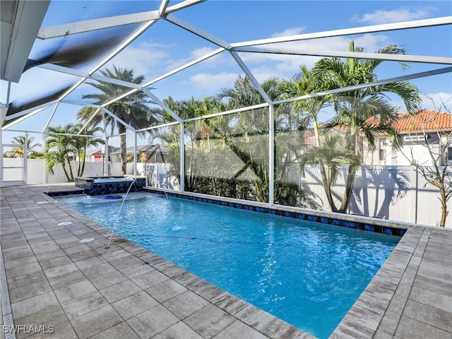 view of pool featuring a lanai and pool water feature