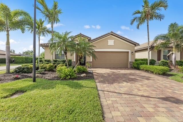 view of front of property featuring a garage and a front yard