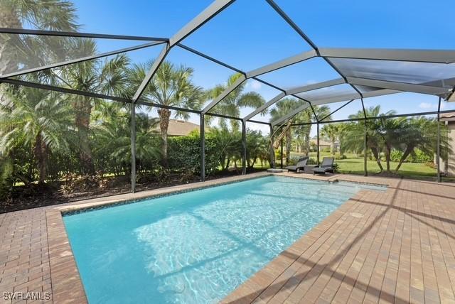 view of pool featuring a lanai and a patio area