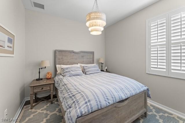 bedroom featuring multiple windows