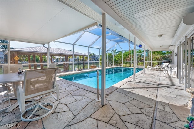 pool with a lanai and a patio