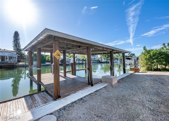 view of dock with a water view and boat lift