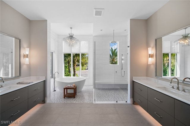 bathroom with vanity, separate shower and tub, and tile patterned floors