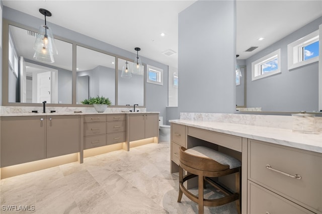 bathroom featuring vanity and toilet