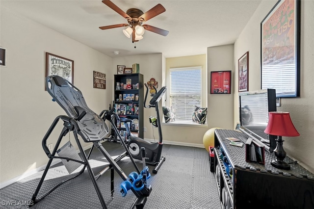 workout room featuring carpet flooring and ceiling fan