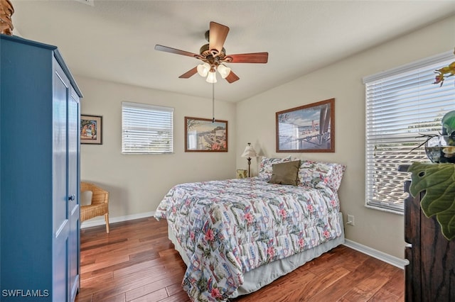 bedroom featuring dark hardwood / wood-style floors and ceiling fan