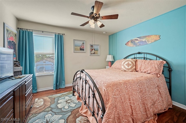 bedroom with ceiling fan and light wood-type flooring