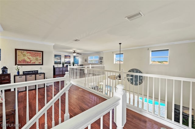 corridor featuring crown molding and hardwood / wood-style floors