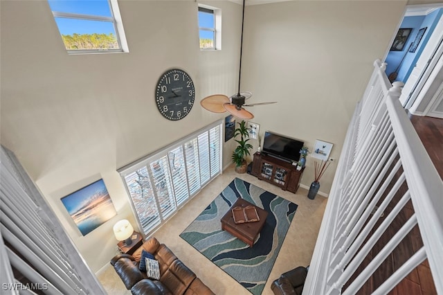 living room featuring a towering ceiling