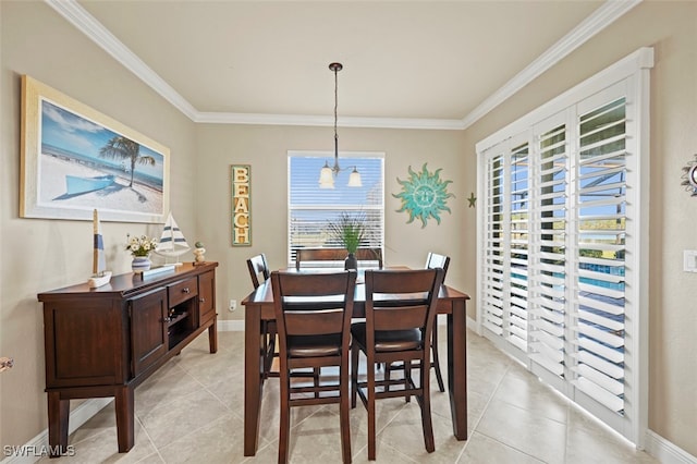 dining room featuring ornamental molding and light tile patterned floors