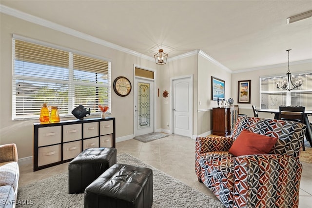 living room featuring an inviting chandelier, crown molding, and light tile patterned flooring